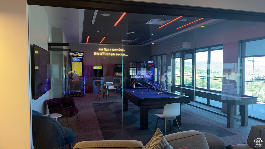 Playroom with carpet floors and billiards