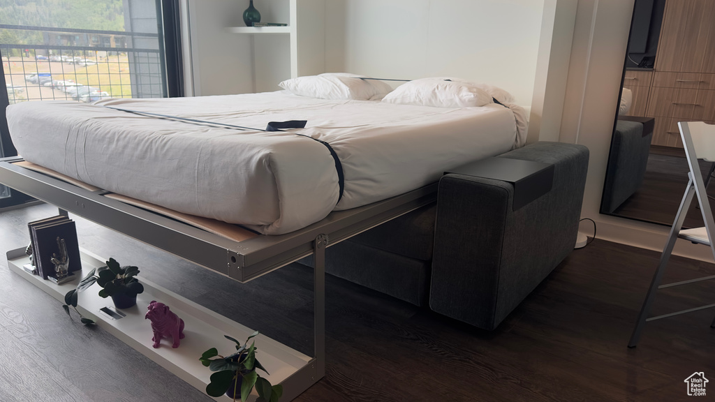 Bedroom featuring dark hardwood / wood-style flooring