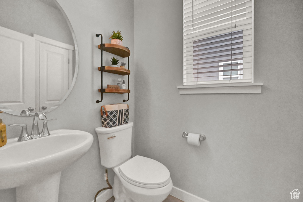 Bathroom featuring sink and toilet