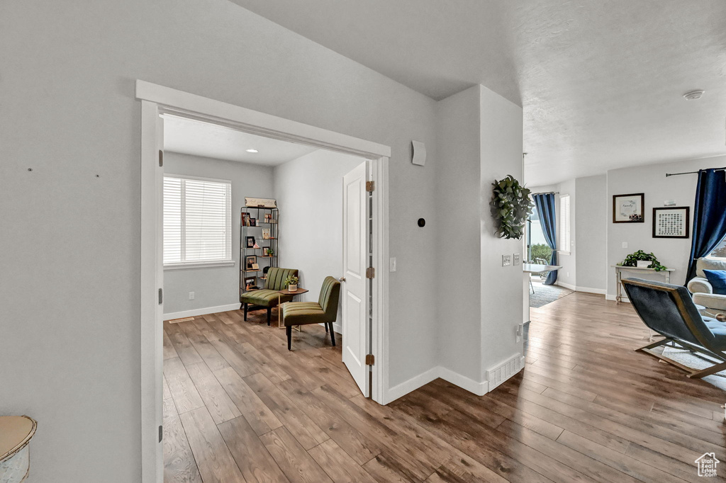 Corridor featuring hardwood / wood-style floors