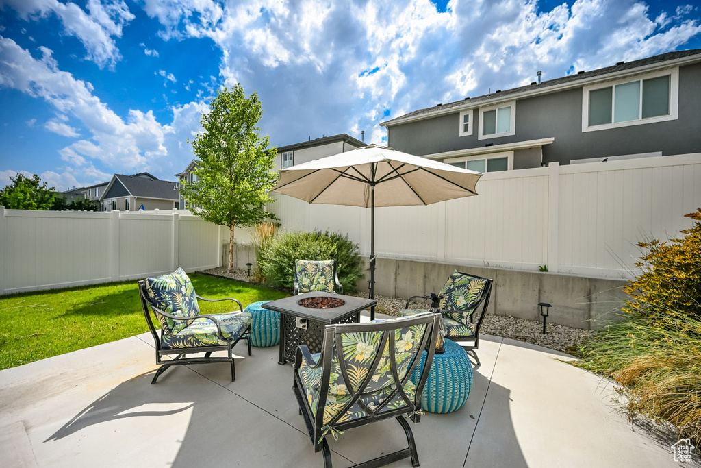 View of patio / terrace with a fire pit