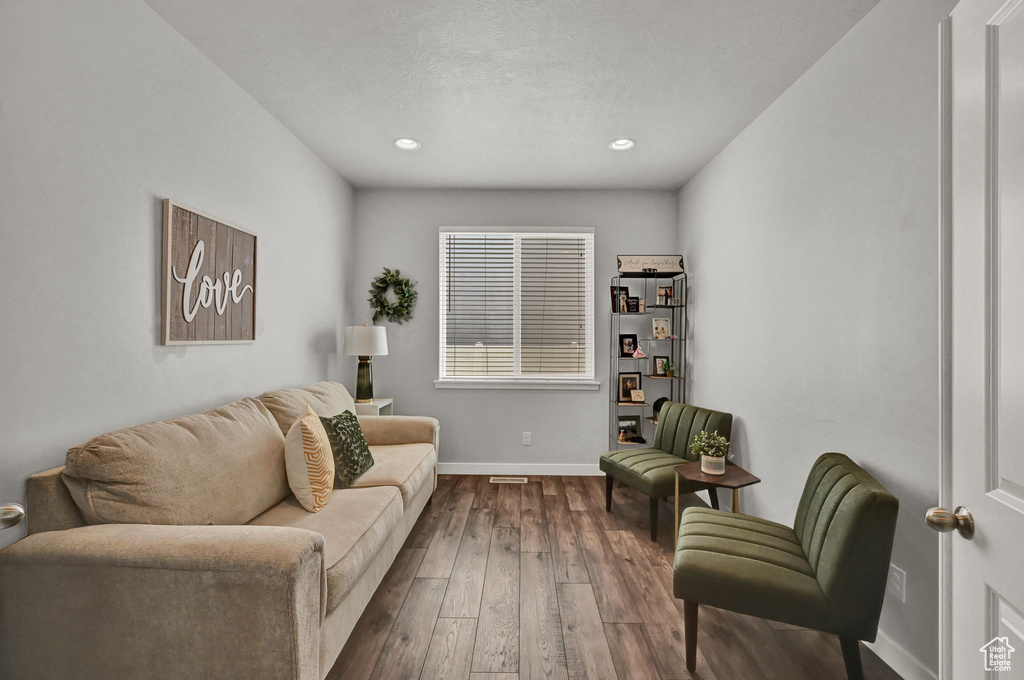 Living room featuring dark hardwood / wood-style flooring