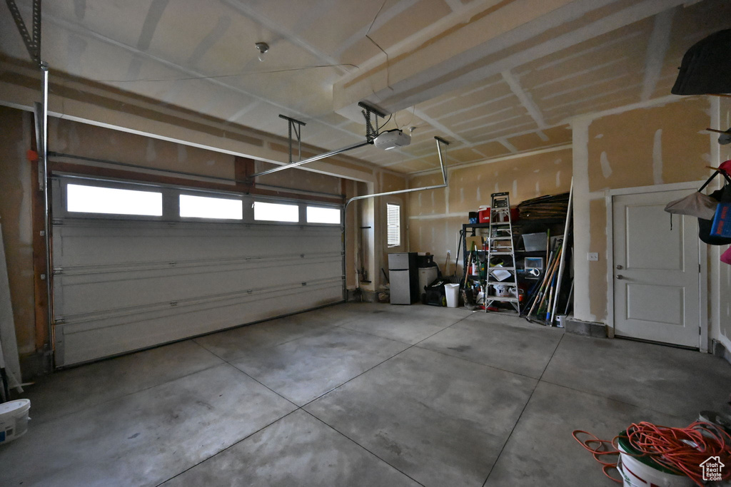 Garage featuring a garage door opener