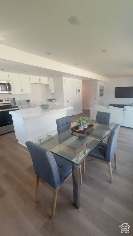 Dining area featuring wood-type flooring