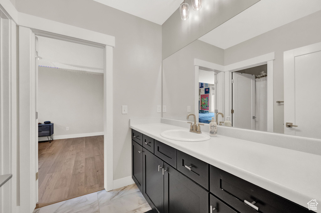 Bathroom featuring wood-type flooring and vanity