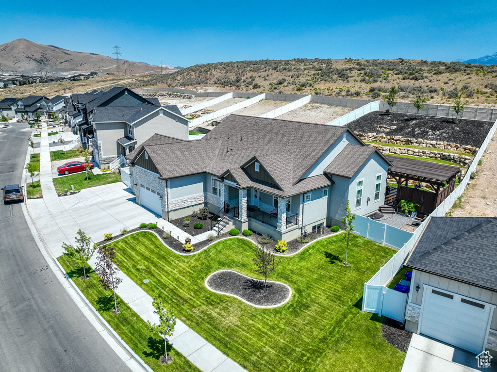 Birds eye view of property with a mountain view