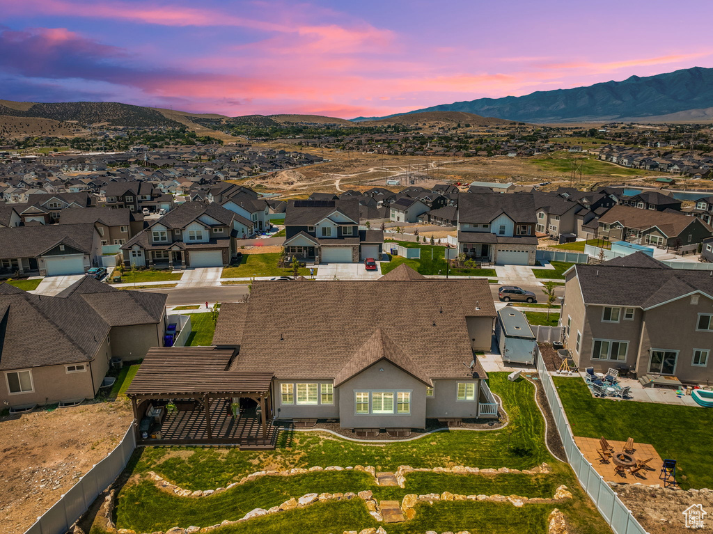 Aerial view at dusk featuring a mountain view