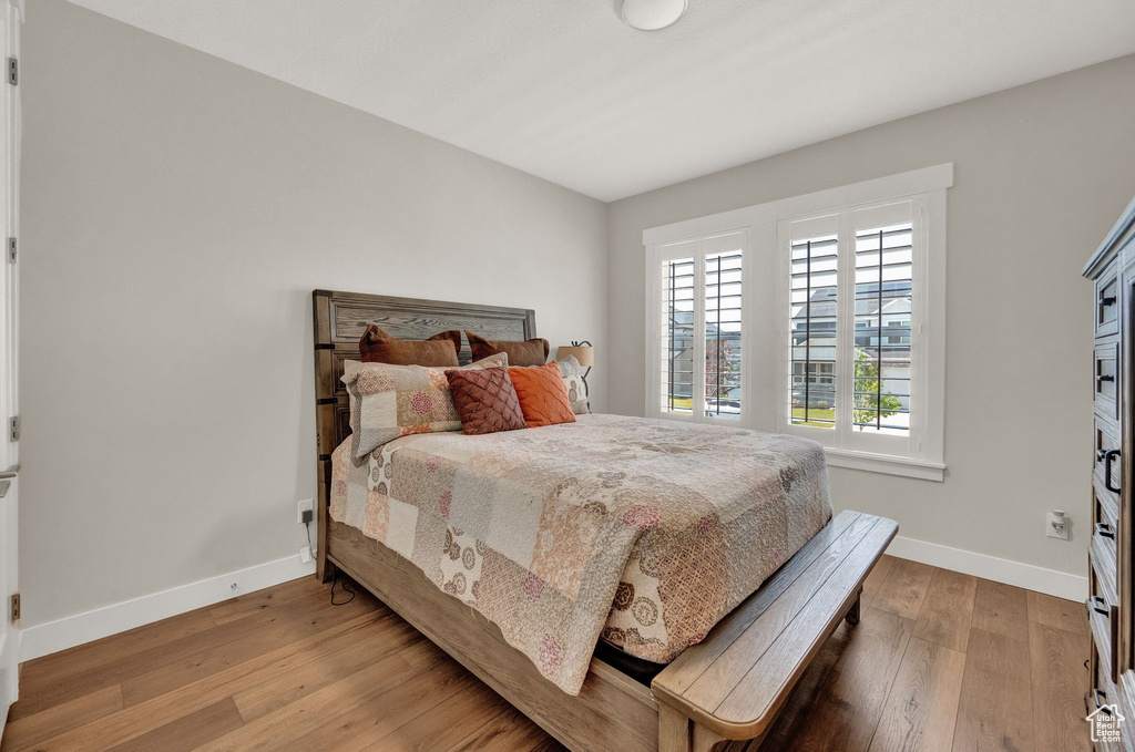 Bedroom featuring wood-type flooring