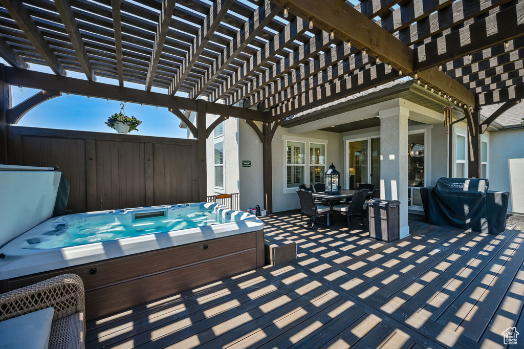 View of patio / terrace featuring a pergola and a covered hot tub