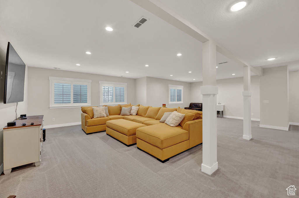 Living room with light carpet and decorative columns