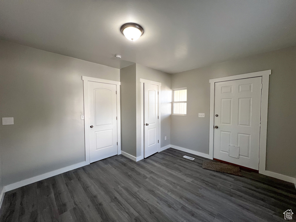 Foyer with dark wood-type flooring