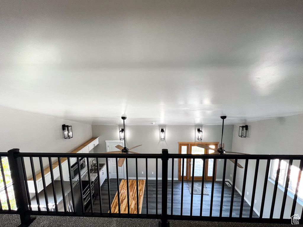 Interior space featuring ceiling fan and wood-type flooring