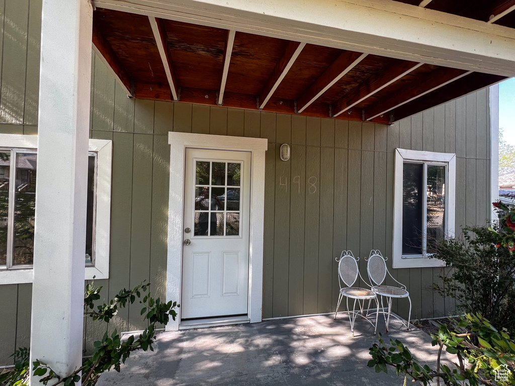 Doorway to property with a patio area