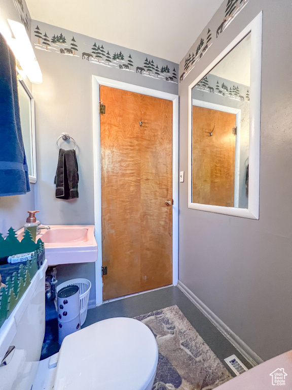 Bathroom with sink and toilet