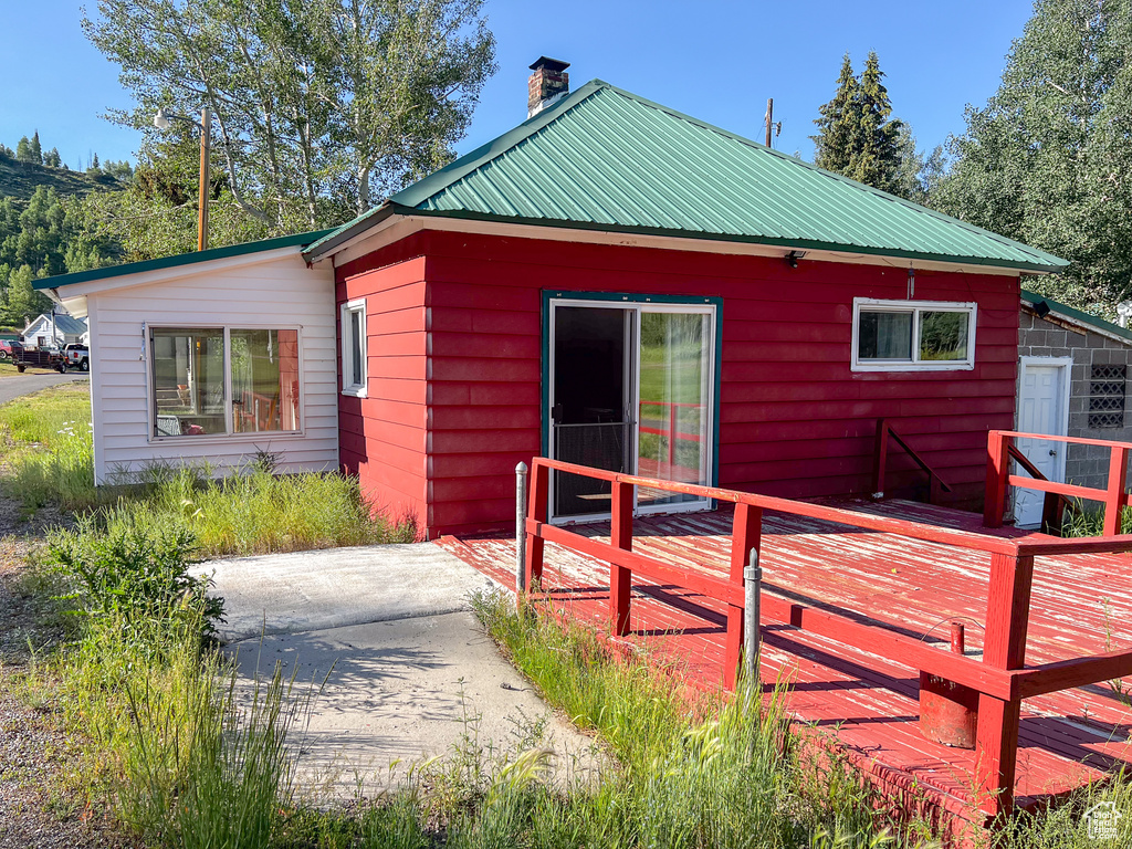 Rear view of house with a deck