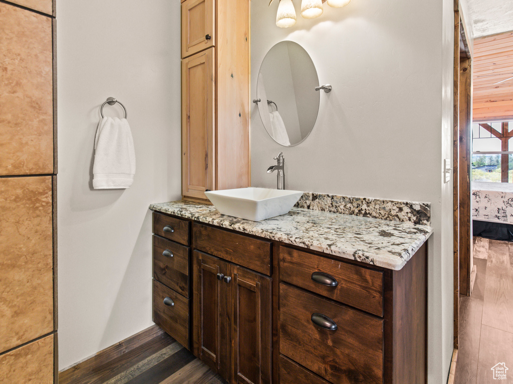 Bathroom with vanity and hardwood / wood-style flooring