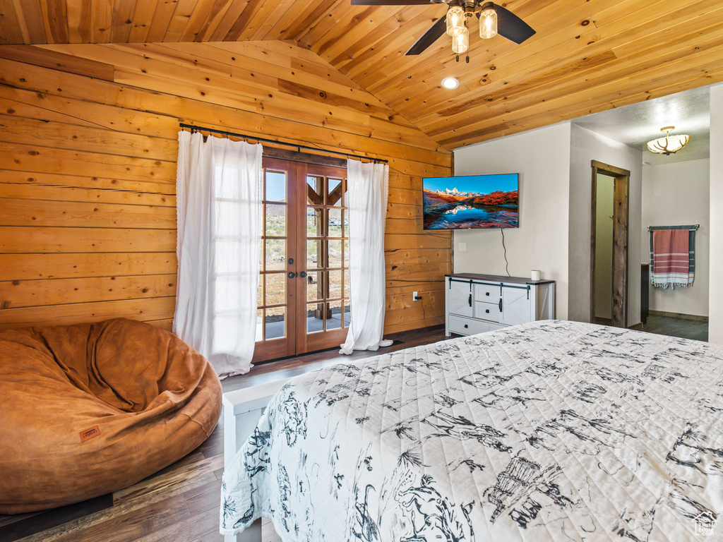 Bedroom featuring wood ceiling, french doors, access to outside, lofted ceiling, and dark hardwood / wood-style flooring