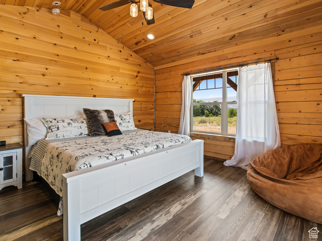 Bedroom with wooden ceiling, lofted ceiling, ceiling fan, and dark hardwood / wood-style floors