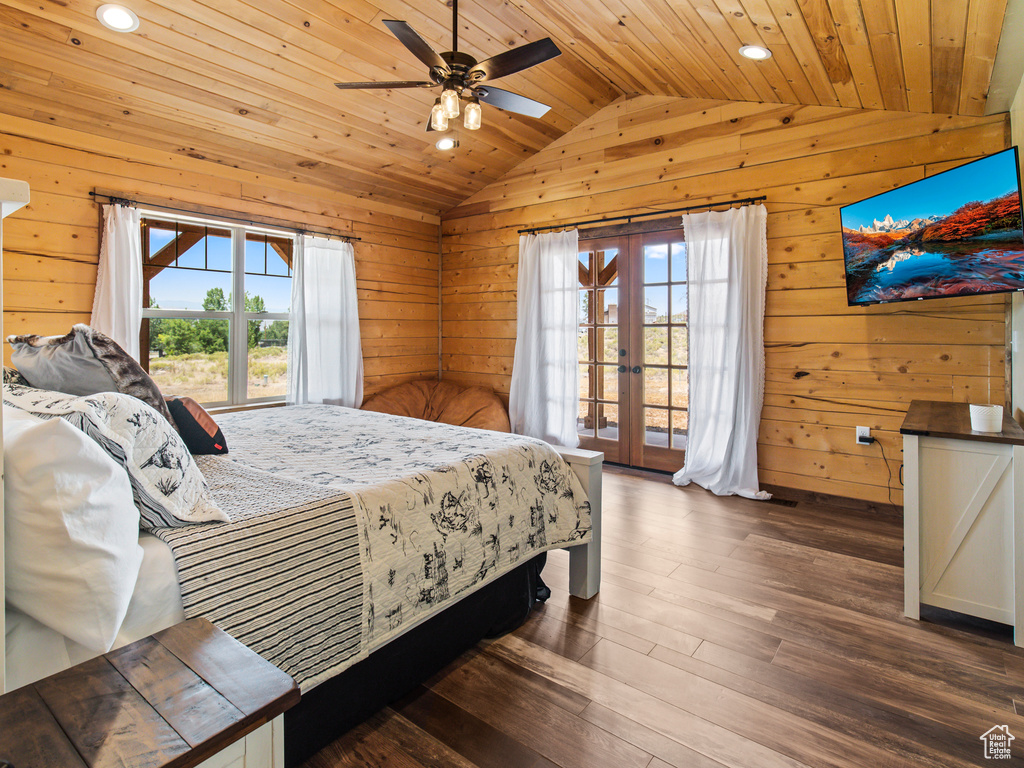 Bedroom featuring access to outside, dark hardwood / wood-style flooring, ceiling fan, wooden ceiling, and vaulted ceiling