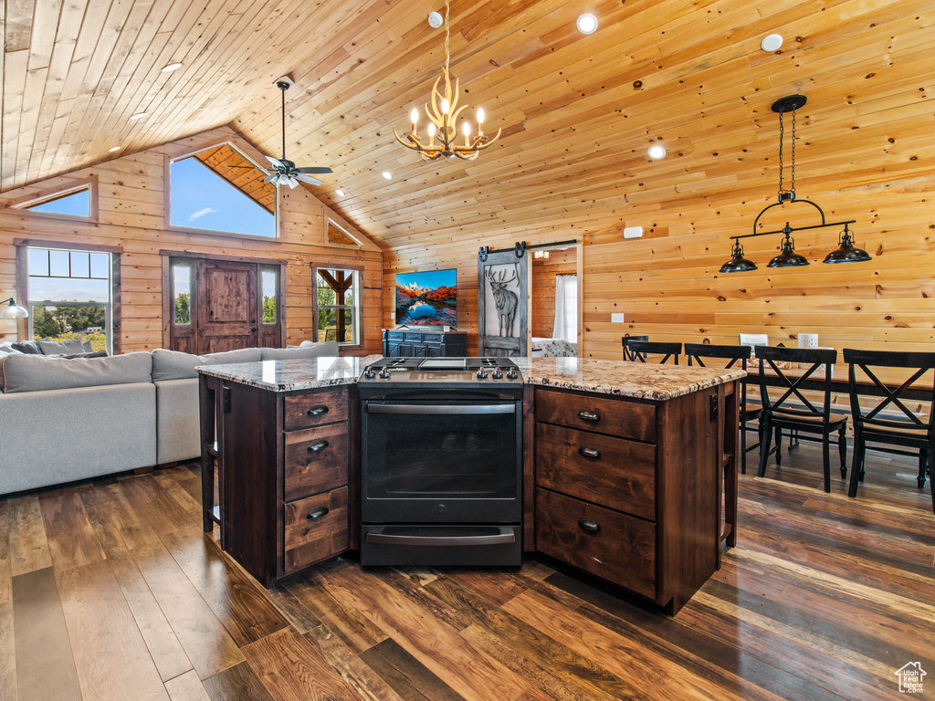 Kitchen featuring wood walls, wood ceiling, pendant lighting, and dark wood-type flooring