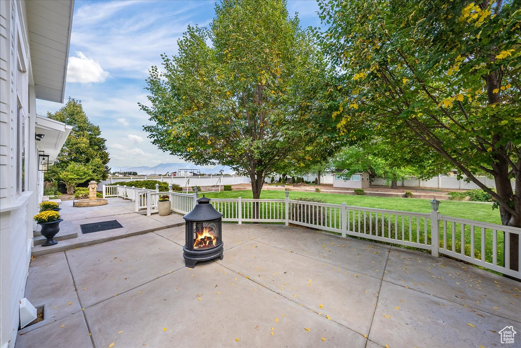 View of patio / terrace featuring an outdoor fire pit