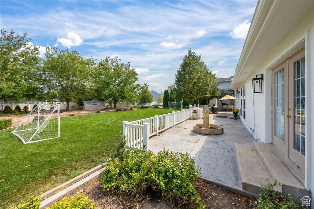 View of yard with a fire pit and a patio