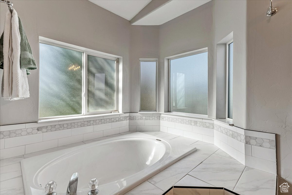 Bathroom with a relaxing tiled tub