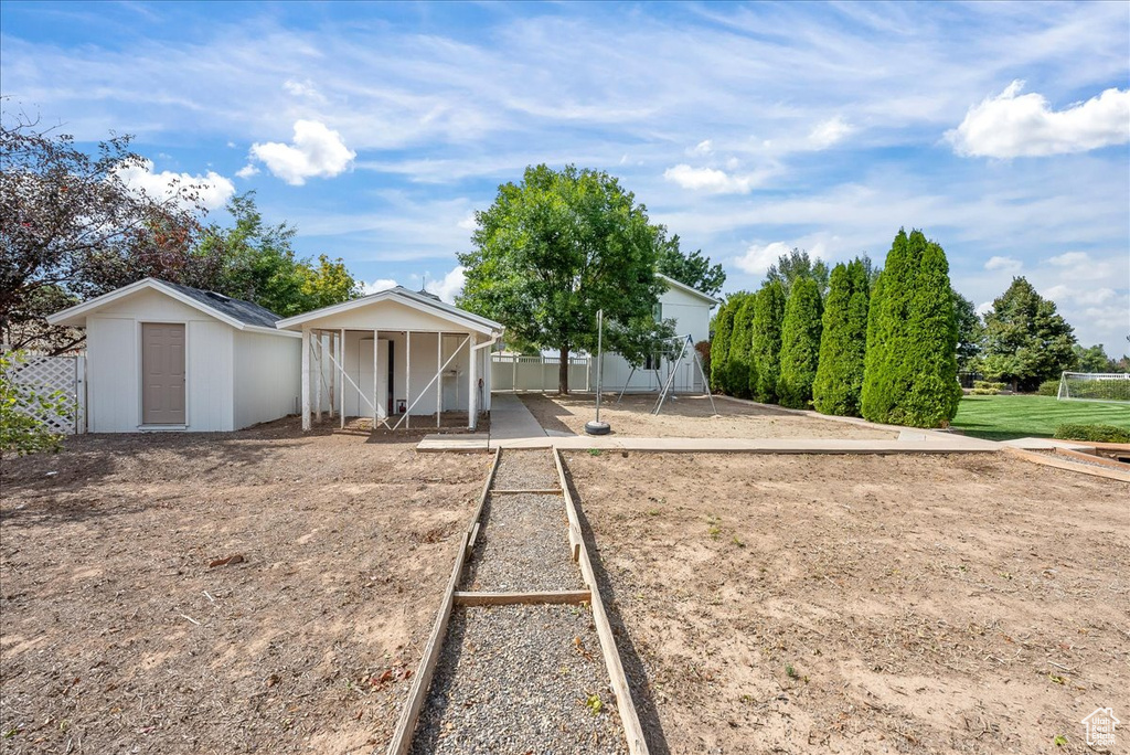 View of front facade featuring a storage shed