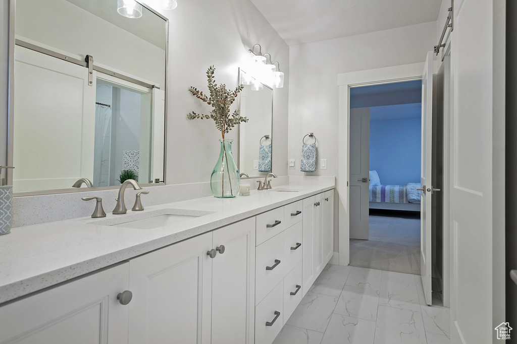 Bathroom featuring dual vanity and tile patterned floors