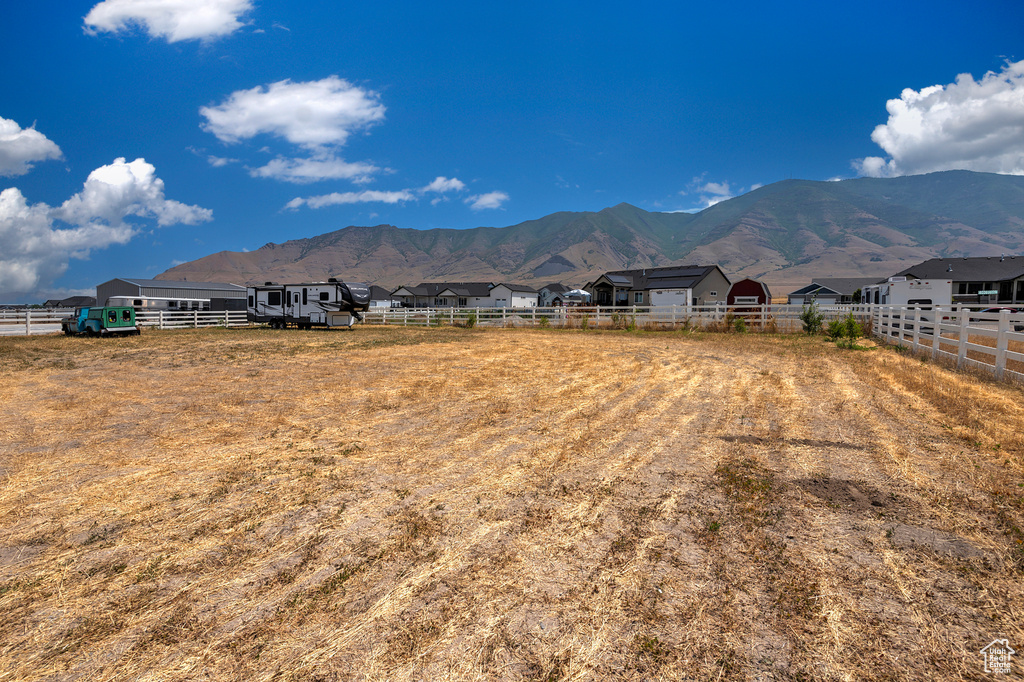 Property view of mountains with a rural view