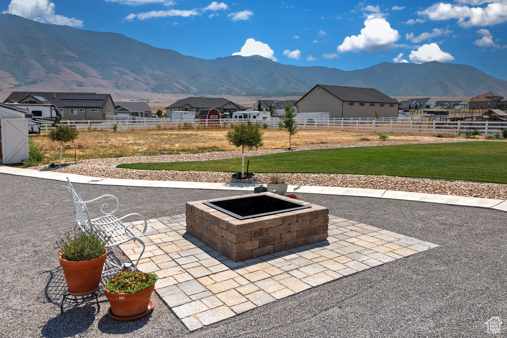 View of patio featuring a mountain view and a fire pit