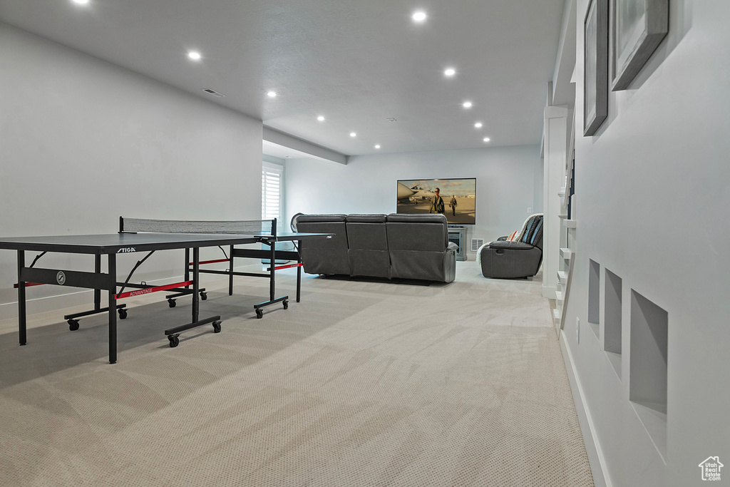 Recreation room featuring light carpet