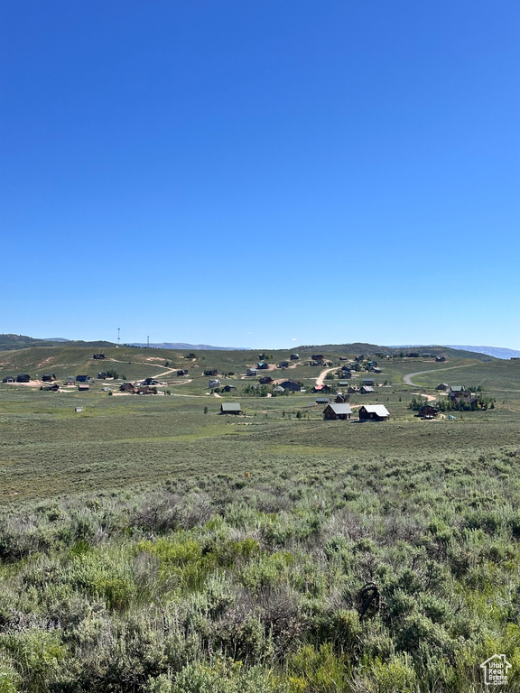 Property view of mountains with a rural view