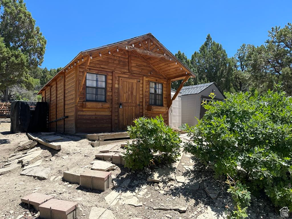 Exterior space with a storage shed