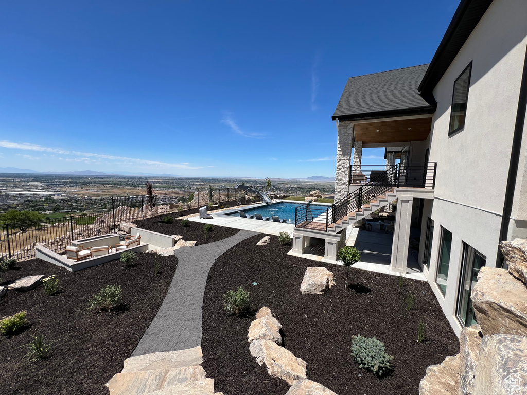 View of yard with a patio area and a fenced in pool