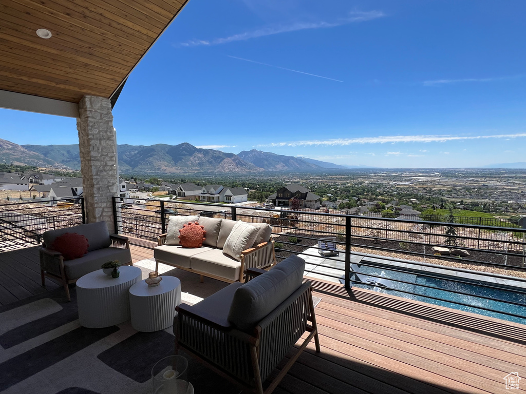 Wooden terrace with a mountain view and an outdoor hangout area