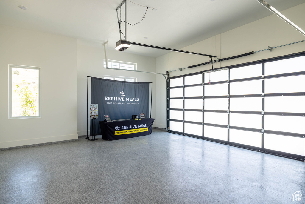 Garage featuring a garage door opener