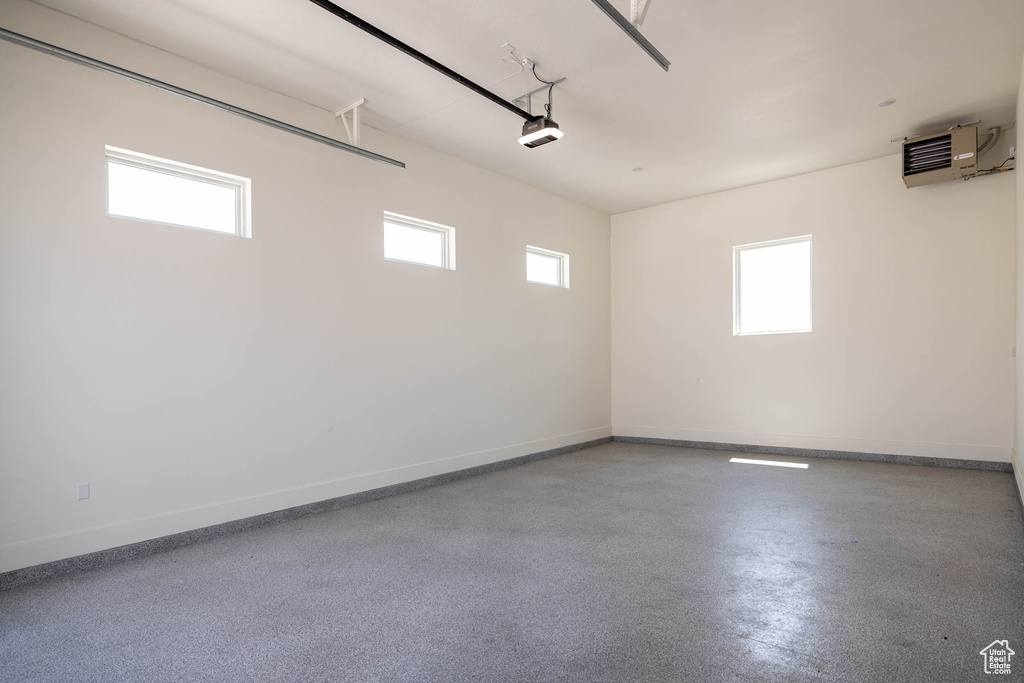 Garage featuring an AC wall unit