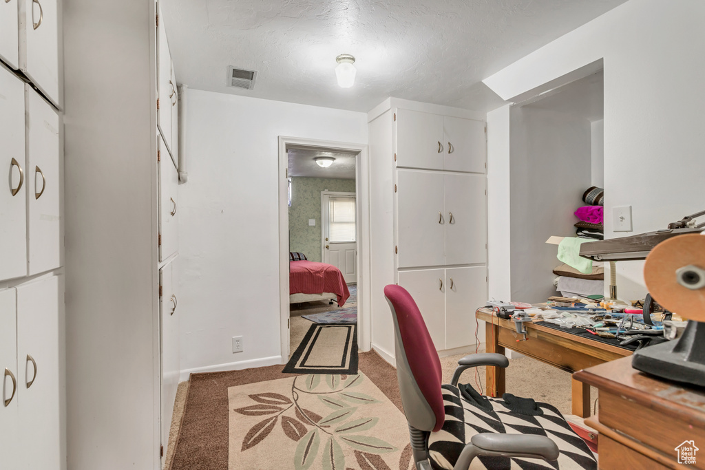 View of carpeted home office