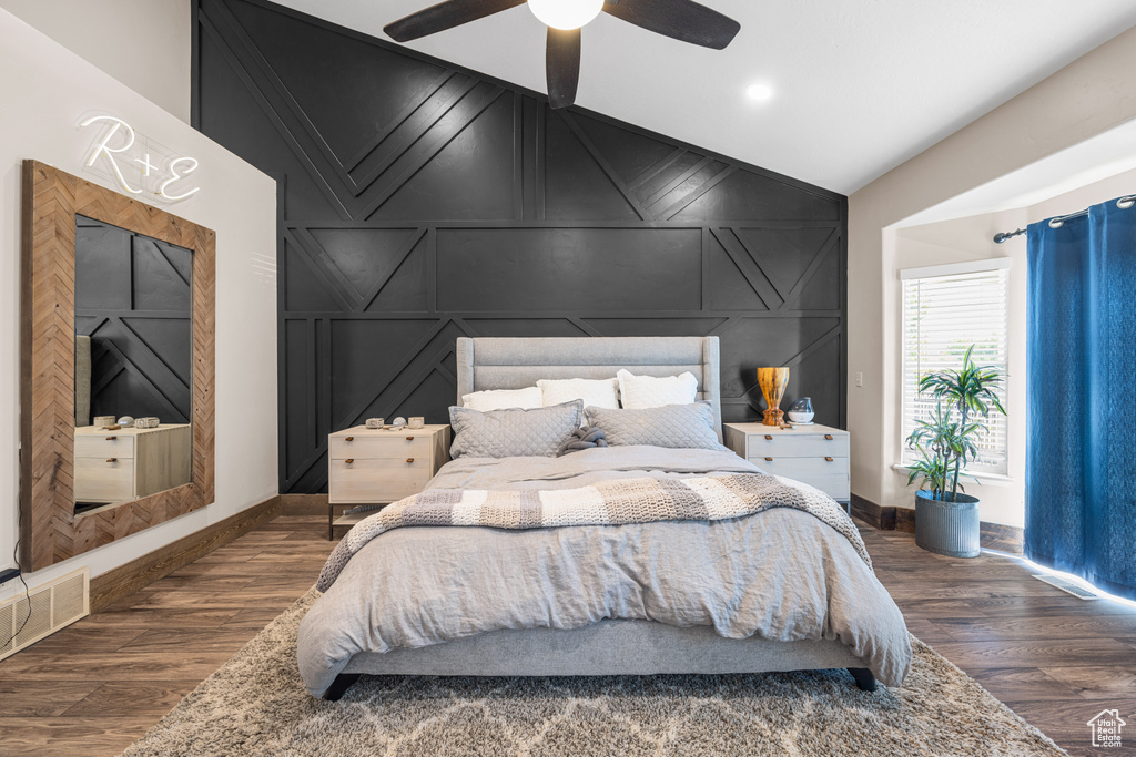 Bedroom featuring lofted ceiling, dark hardwood / wood-style flooring, and ceiling fan