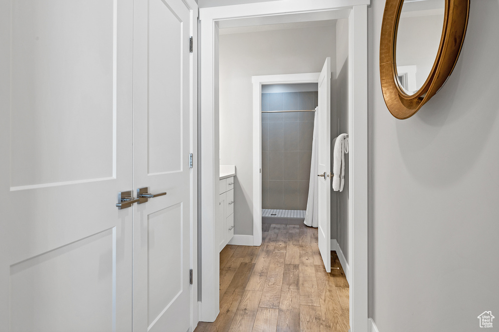 Hall featuring light hardwood / wood-style flooring