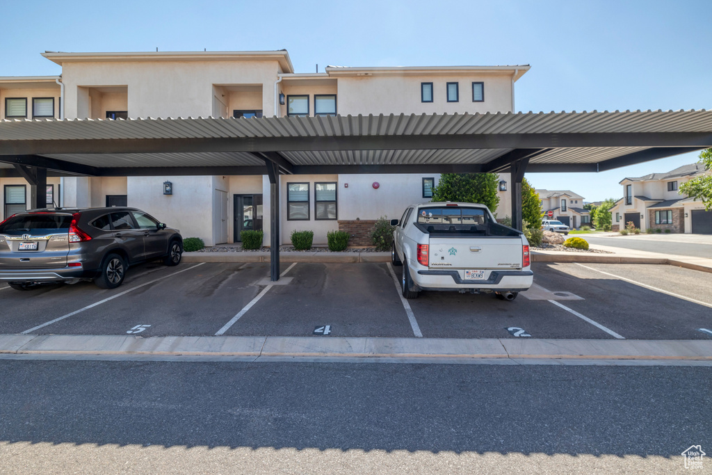 View of vehicle parking with a carport