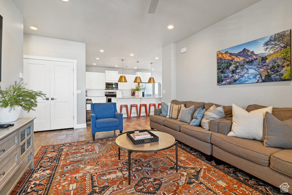 Living room with hardwood / wood-style flooring