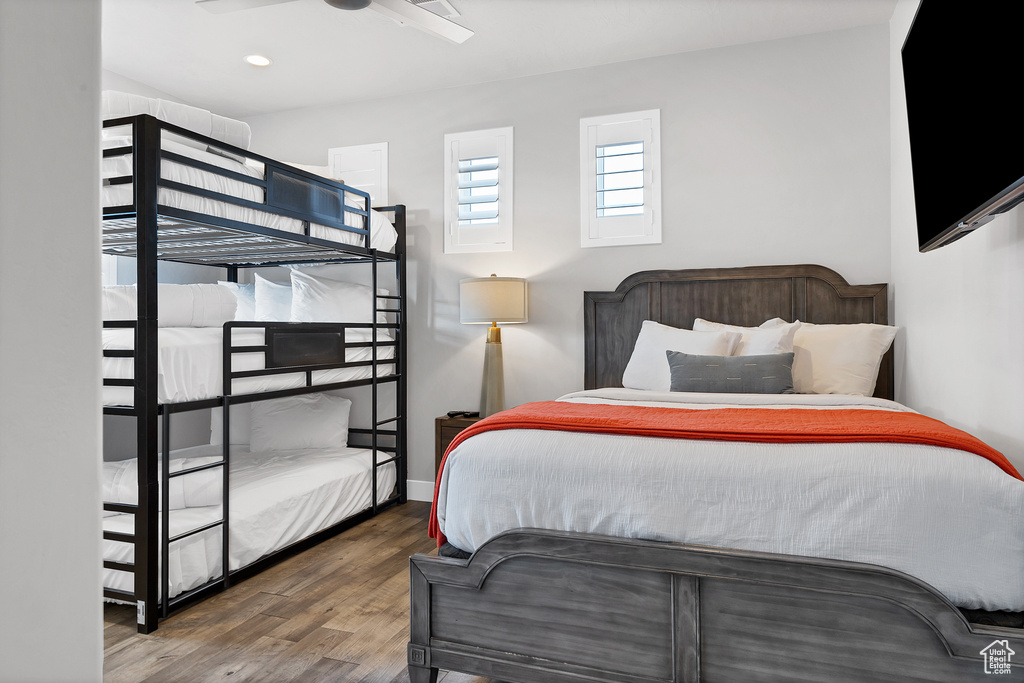 Bedroom with wood-type flooring and ceiling fan