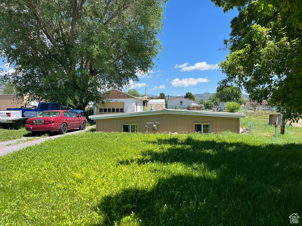 View of front of property with a front yard