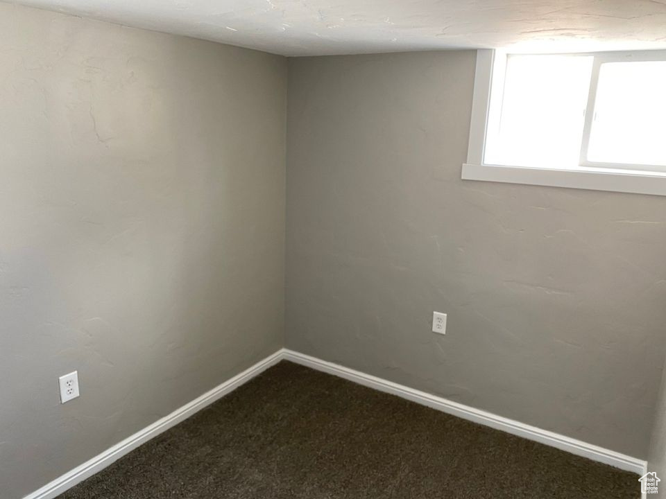 Unfurnished room with carpet floors