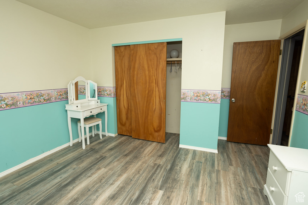 Bedroom featuring a closet and hardwood / wood-style flooring