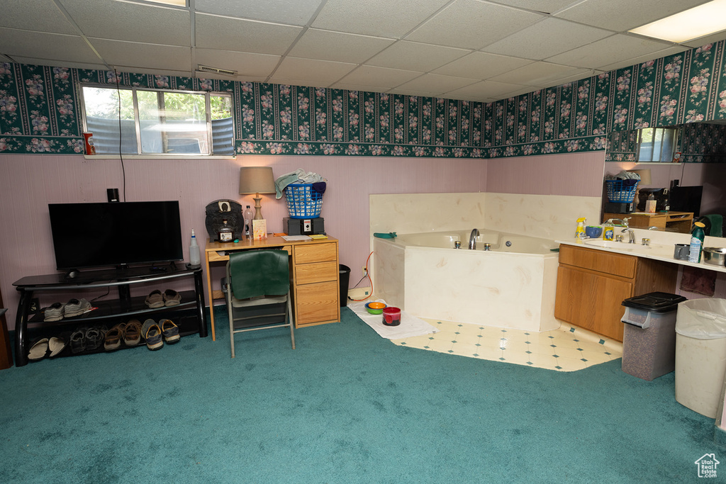 Interior space with sink and a paneled ceiling