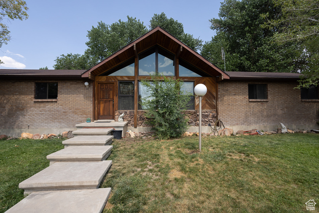 View of front of property with a front yard