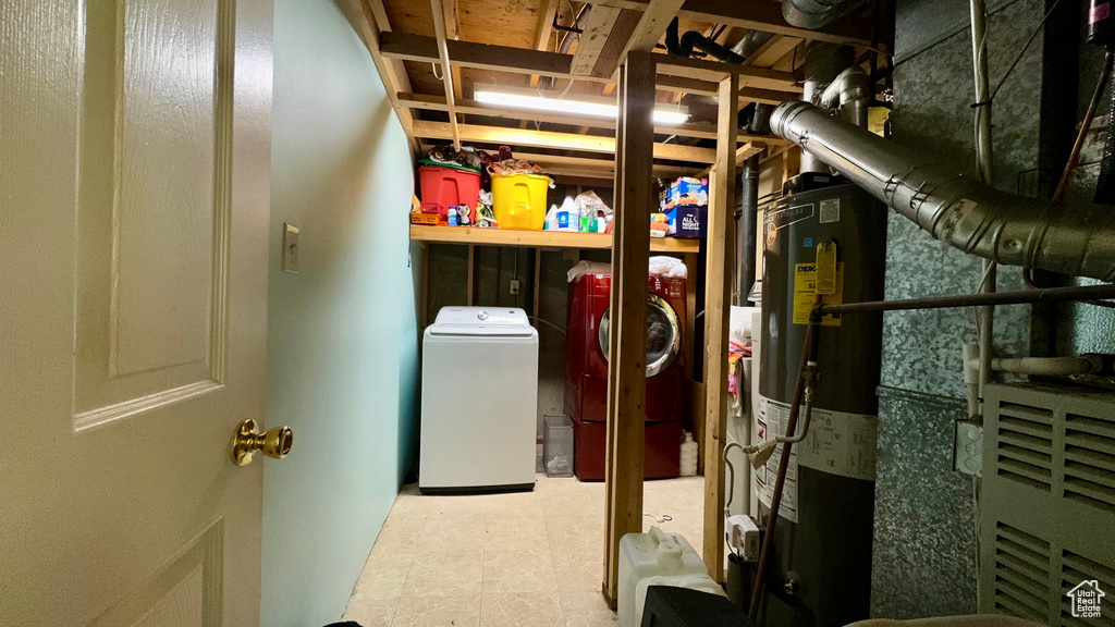 Interior space featuring separate washer and dryer and water heater